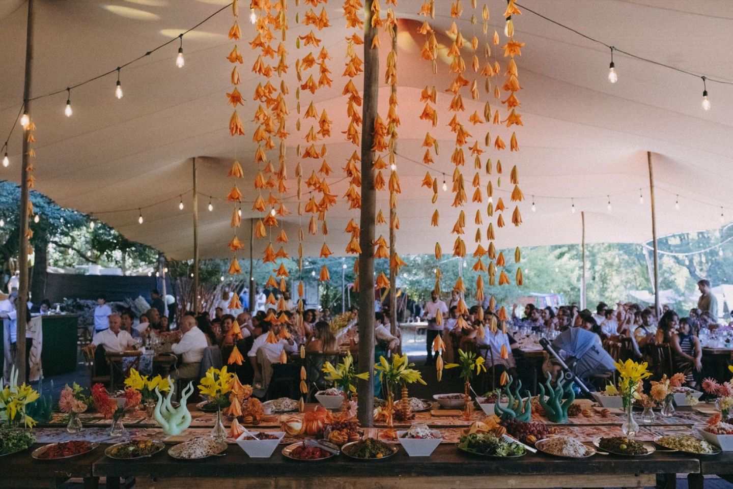 Decorated wedding banquet beneath a Bedu Tents canopy