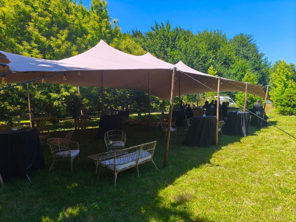 Bedouin stretch tent for an outdoor event in a meadow