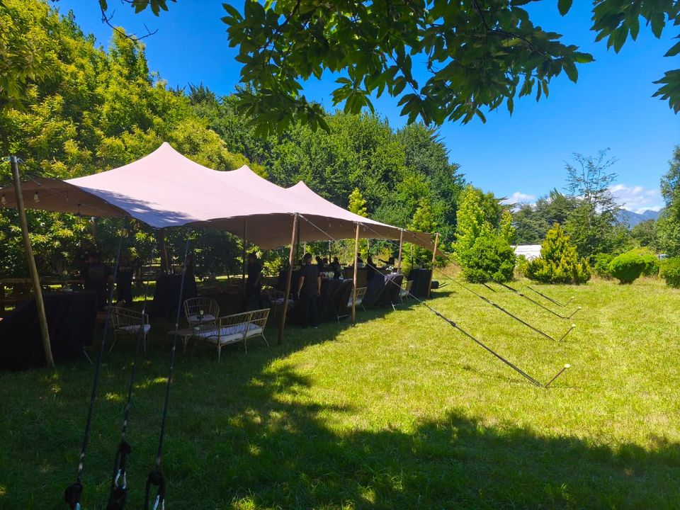 Bedouin event tent installed in a green garden