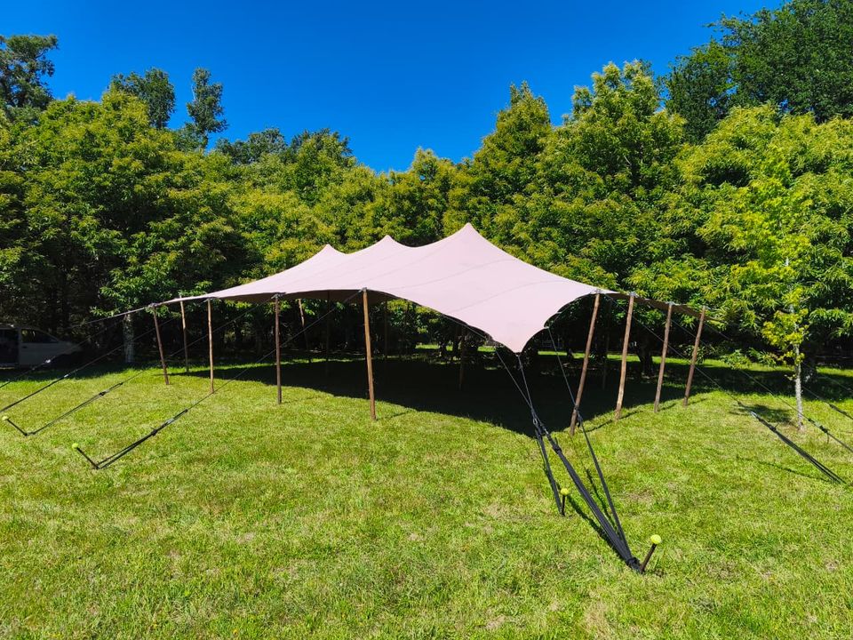 Bedouin tent beneath the shade of a green garden