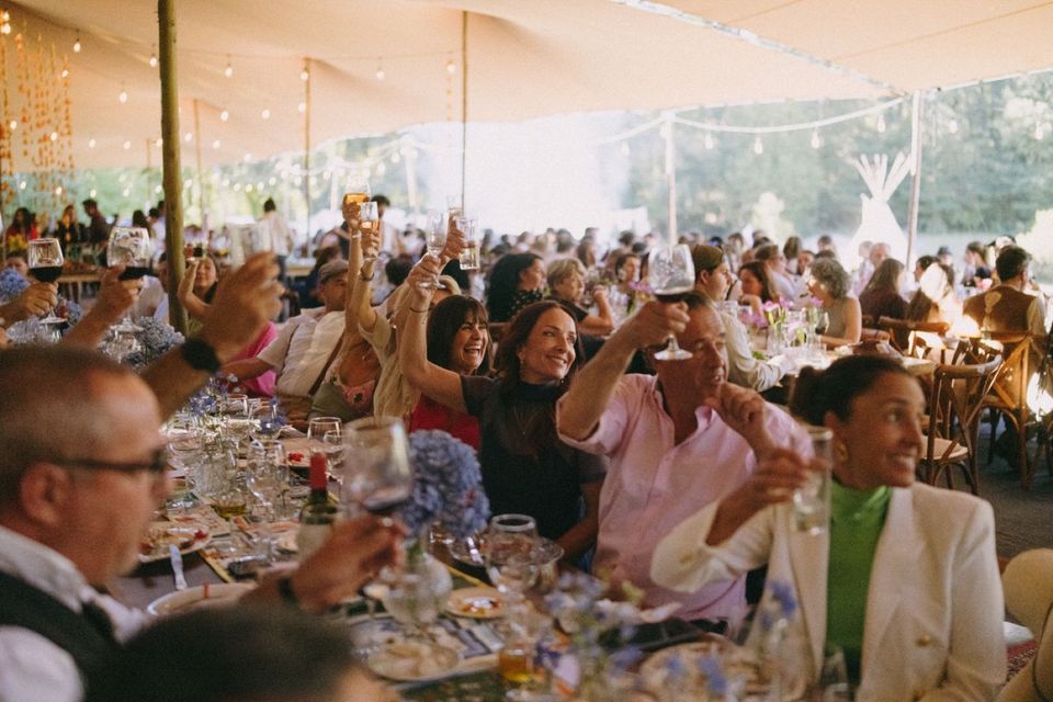 Guests celebrating beneath a Bedouin stretch tent