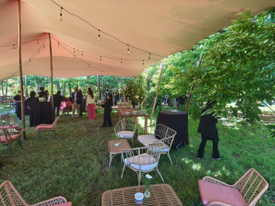 Garden wedding dinner beneath a Bedouin tent