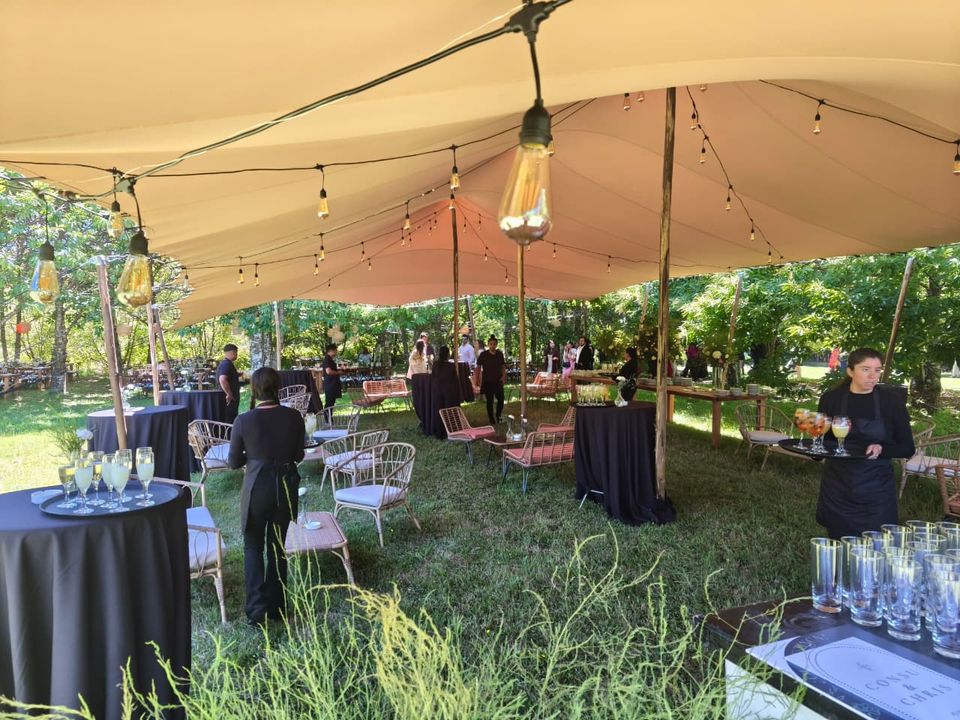 Event cocktails served beneath a Bedouin stretch tent