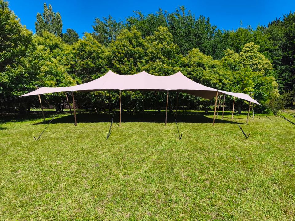 Wedding tables set beneath a Bedouin tent